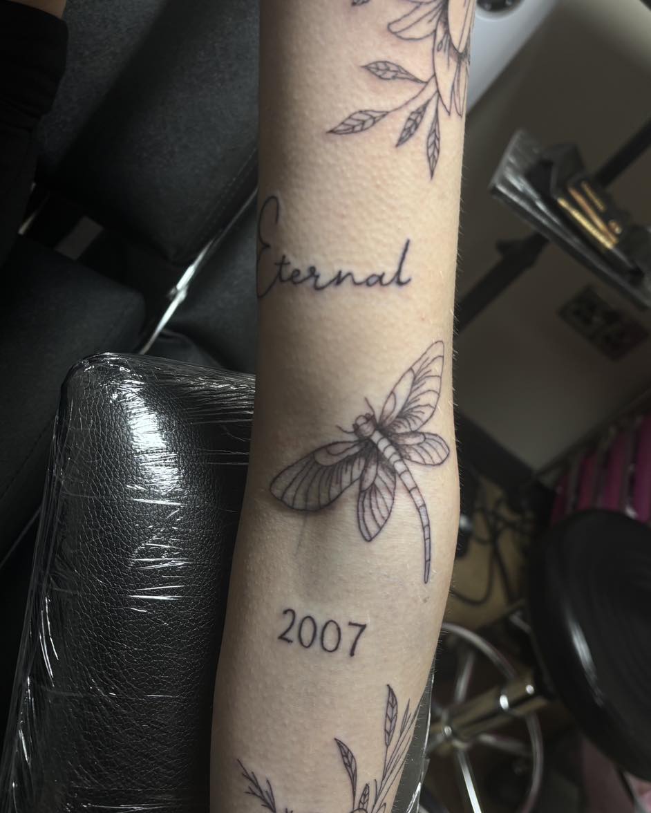 Dragonfly with 'Eternal' script